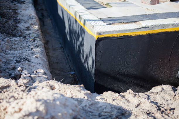 Professional Exterior Waterproofing technician working in Columbus, NC